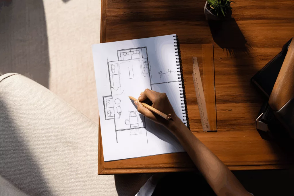 elizgroup top down view of an Asian designers hand sketching d3b8f74e febd 4626 bdaa 2853c3403af4 0